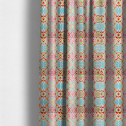 The fabric used to create these made-to-measure curtains is a vibrant, repeating pattern featuring abstract botanical shapes, paisley motifs, and floral elements in bright shades of pink, turquoise blue, lime green, and orange.
