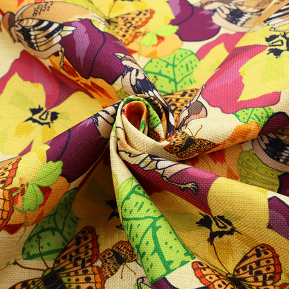 Detailed repeating pattern featuring sparrows, butterflies, and large pansy flowers in shades of yellow, purple, orange, and red against a cream background.