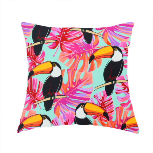 The fabric used to create this handmade cushion features vibrant, tropical-themed repeating pattern showcasing toucans and exotic foliage.
