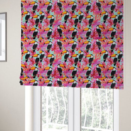 The fabric used to create these Roman blinds features vibrant, tropical-themed repeating pattern showcasing toucans and exotic foliage.