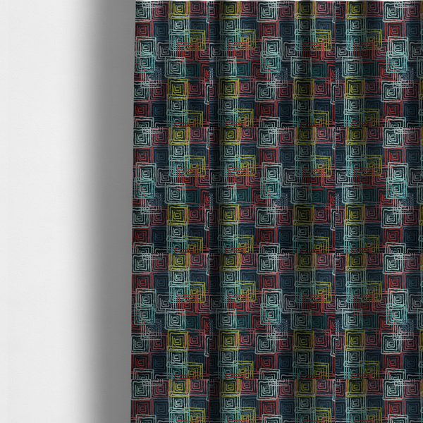 The fabric used to create these made-to-measure curtains is an abstract geometric pattern featuring overlapping nested squares in vibrant shades of red, teal, yellow, and grey on a dark background.