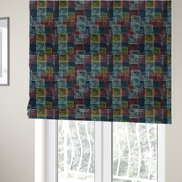 The fabric used to create these Roman blinds is an abstract geometric pattern featuring overlapping nested squares in vibrant shades of red, teal, yellow, and grey on a dark background.