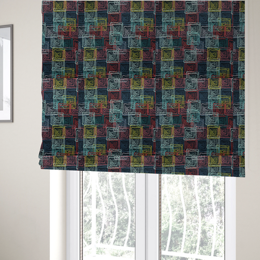 The fabric used to create these Roman blinds is an abstract geometric pattern featuring overlapping nested squares in vibrant shades of red, teal, yellow, and grey on a dark background.