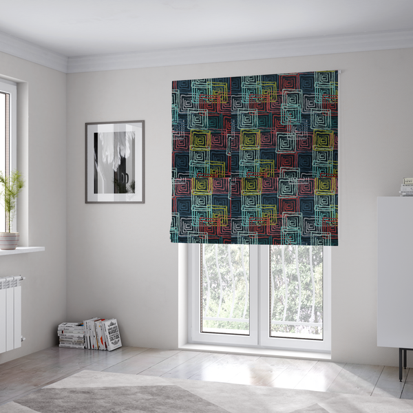 The fabric used to create these Roman blinds is an abstract geometric pattern featuring overlapping nested squares in vibrant shades of red, teal, yellow, and grey on a dark background.