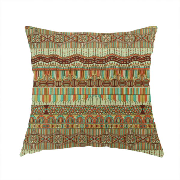 the fabric used to create this handmade cushion features intricate, vibrant geometric pattern with horizontal bands in teal, orange, brown, and yellow.