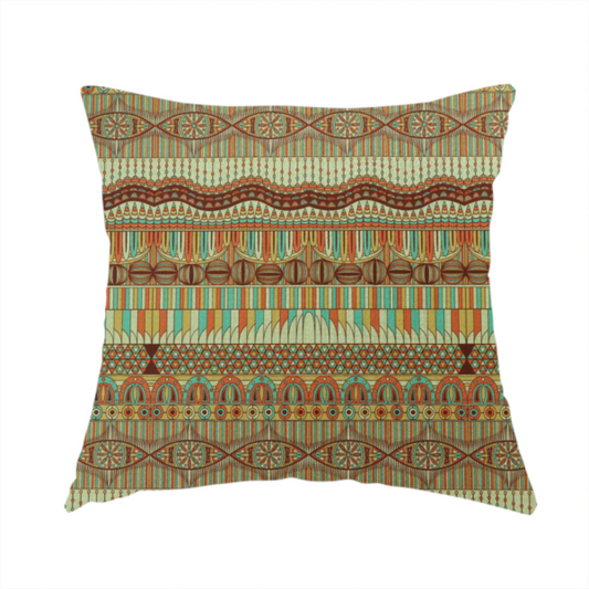 the fabric used to create this handmade cushion features intricate, vibrant geometric pattern with horizontal bands in teal, orange, brown, and yellow.