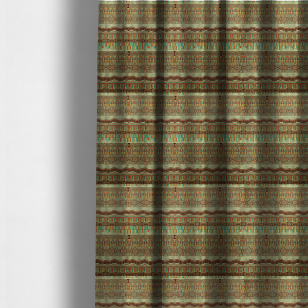 The fabric used to create these made-to-measure curtains features intricate, vibrant geometric pattern with horizontal bands in teal, orange, brown, and yellow.