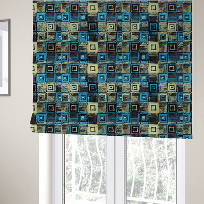 The fabric used to create these Roman blinds is an abstract geometric pattern featuring nested squares in shades of bright blue, pale yellow, dark grey, and black.