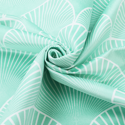 Elegant, repeating Art Deco-inspired fan pattern in a soft mint green and white colour palette.