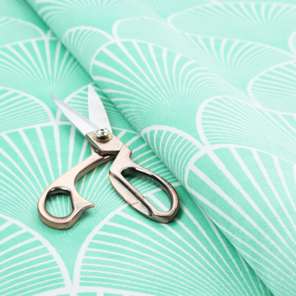Elegant, repeating Art Deco-inspired fan pattern in a soft mint green and white colour palette.