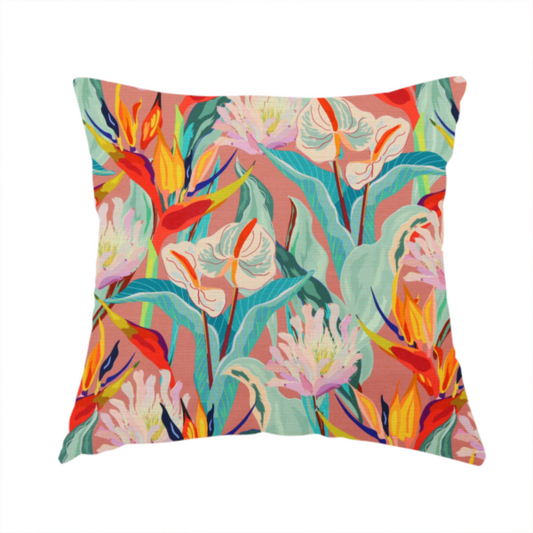 The fabric used to create this handmade cushion is a vibrant repeating botanical pattern featuring tropical flowers, including birds of paradise and white anthuriums, with large green leaves against a dusty pink background.