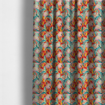 The fabric used to create these made-to-measure curtains is a vibrant repeating botanical pattern featuring tropical flowers, including birds of paradise and white anthuriums, with large green leaves against a dusty pink background.