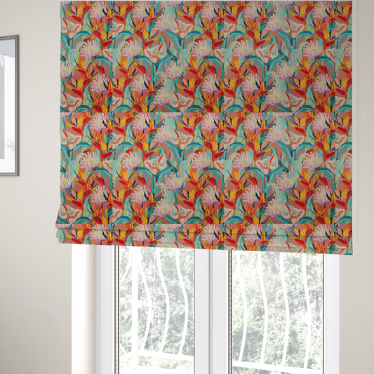 The fabric used to create these Roman blinds is a vibrant repeating botanical pattern featuring tropical flowers, including birds of paradise and white anthuriums, with large green leaves against a dusty pink background.