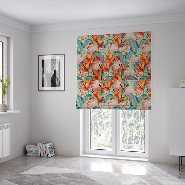 The fabric used to create these Roman blinds is a vibrant repeating botanical pattern featuring tropical flowers, including birds of paradise and white anthuriums, with large green leaves against a dusty pink background.