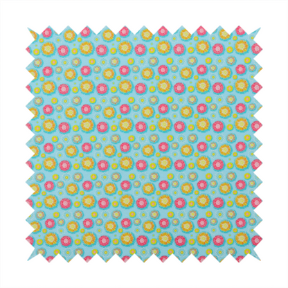 Light blue fabric featuring an all-over repeating pattern of vibrant pink and gold floral motifs interspersed with small yellow dotted accents.