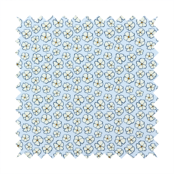 A light blue fabric featuring a dense, repeating pattern of small white flowers with yellow centres and dark outlines.
