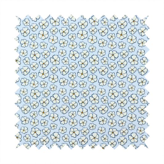 A light blue fabric featuring a dense, repeating pattern of small white flowers with yellow centres and dark outlines.