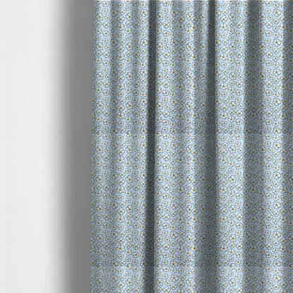 The fabric used to create these made-to-measure curtains is a light blue fabric featuring a dense, repeating pattern of small white flowers with yellow centres and dark outlines.