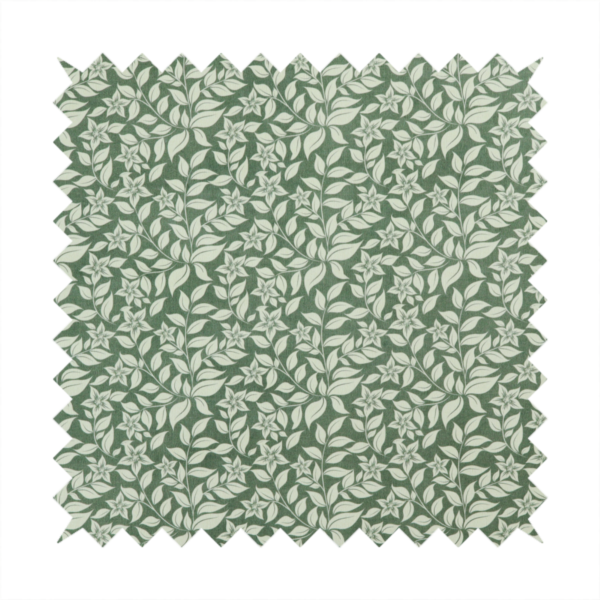 A green fabric featuring an intricate, repeating botanical pattern of trailing vines, leaves, and small white flowers.