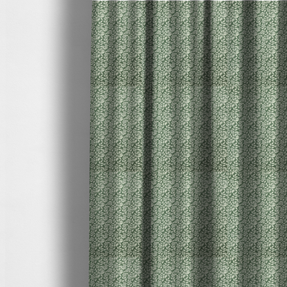 The fabric used to create these made-to-measure curtains is a green fabric featuring an intricate, repeating botanical pattern of trailing vines, leaves, and small white flowers.