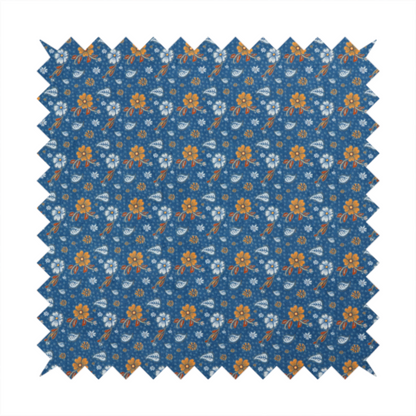 A royal blue fabric featuring a detailed, repeating pattern of orange and white flowers, small leaves, and sprigs
