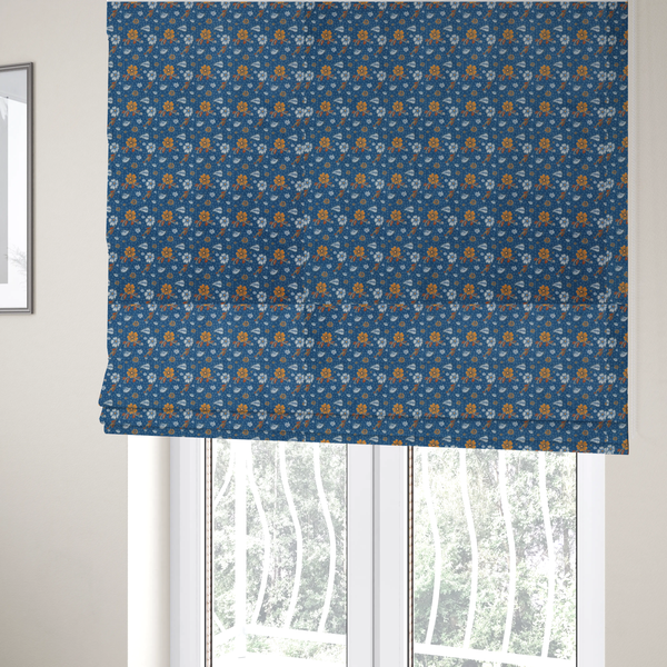 The fabric used to create these Roman blinds is a royal blue fabric featuring a detailed, repeating pattern of orange and white flowers, small leaves, and sprigs