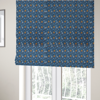 The fabric used to create these Roman blinds is a royal blue fabric featuring a detailed, repeating pattern of orange and white flowers, small leaves, and sprigs