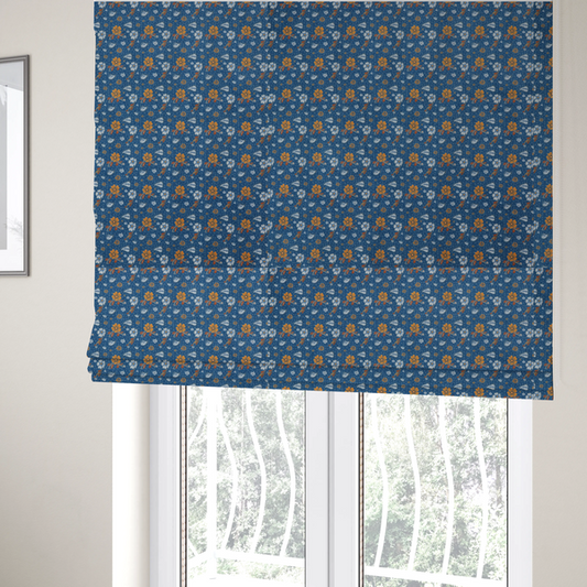 The fabric used to create these Roman blinds is a royal blue fabric featuring a detailed, repeating pattern of orange and white flowers, small leaves, and sprigs
