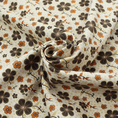 A light cream fabric featuring a repeating retro pattern of dark brown and orange flowers with scrolling vines.