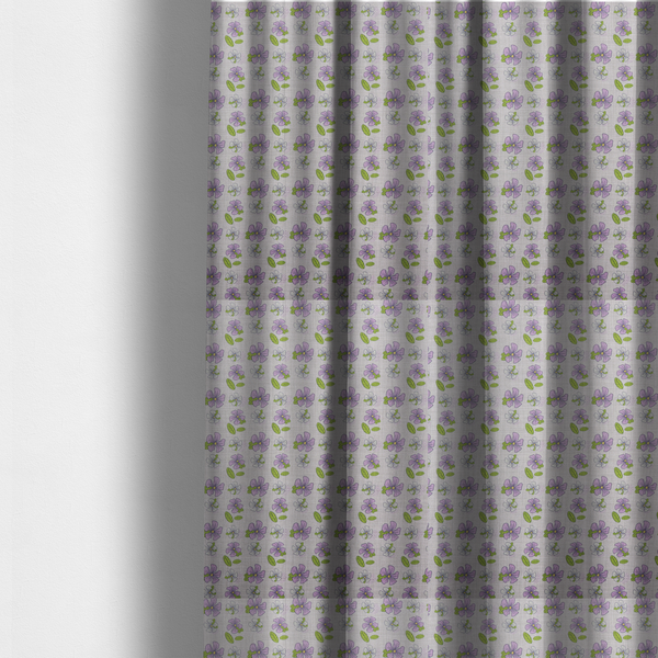 The fabric used to create these made-to-measure curtains is a light grey-purple fabric featuring a repeating pattern of purple and white flowers with green leaves.
