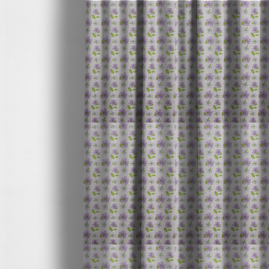The fabric used to create these made-to-measure curtains is a light grey-purple fabric featuring a repeating pattern of purple and white flowers with green leaves.