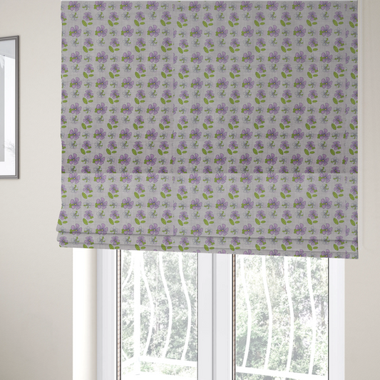 The fabric used to create these Roman blinds is a light grey-purple fabric featuring a repeating pattern of purple and white flowers with green leaves.