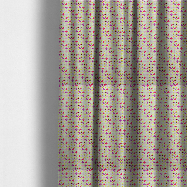 The fabric used to create these made-to-measure curtains is a light green fabric featuring a dense, repeating pattern of small multi-coloured butterflies in pink, magenta, and purple, interspersed with tiny yellow flowers and dots.