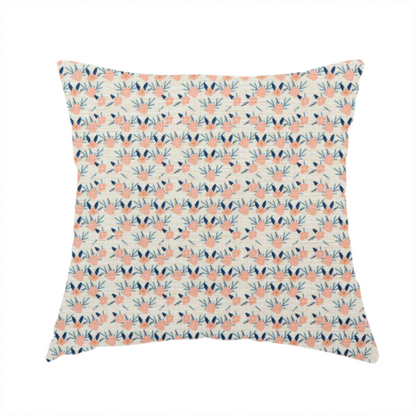 The fabric used to create this handmade cushion is an off-white fabric featuring a neat, repeating geometric pattern of small peach-pink flowers and dark blue leafy sprigs.