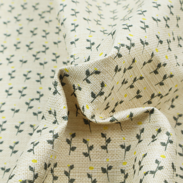 This fabric features a delicate, small-scale floral print on a textured, light cream or off-white background that resembles natural linen.