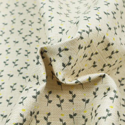 This fabric features a delicate, small-scale floral print on a textured, light cream or off-white background that resembles natural linen.