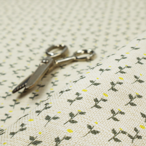 This fabric features a delicate, small-scale floral print on a textured, light cream or off-white background that resembles natural linen.