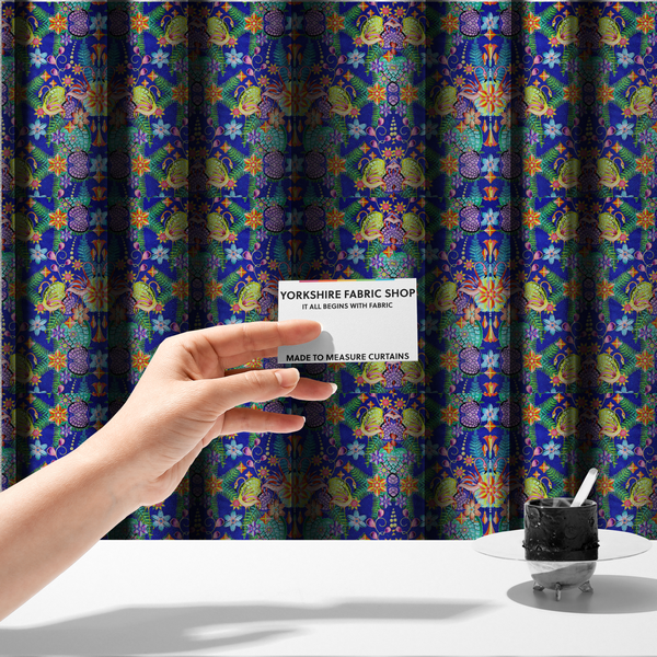 The fabric used to create these made-to-measure curtains is a fabric features an intricate, psychedelic-inspired tropical print with a rich, dark blue background.