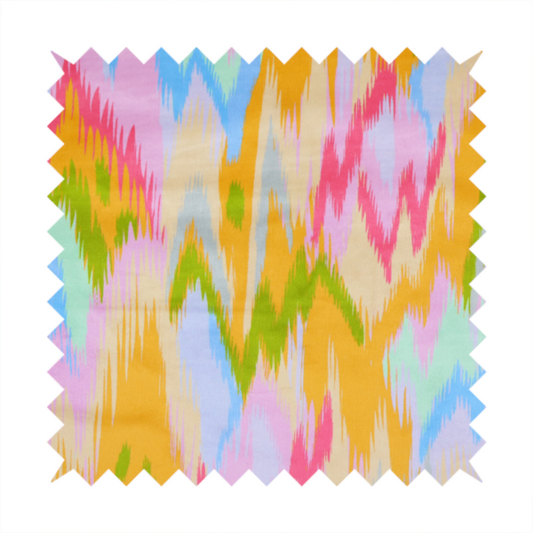 This fabric features a vibrant, multi-coloured ikat-style pattern with a soft, blurred aesthetic.