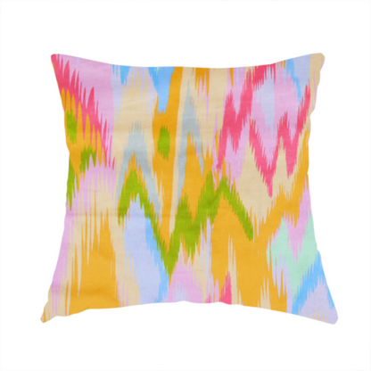 The fabric used to create this handmade cushions is a fabric features a vibrant, multi-coloured ikat-style pattern with a soft, blurred aesthetic.