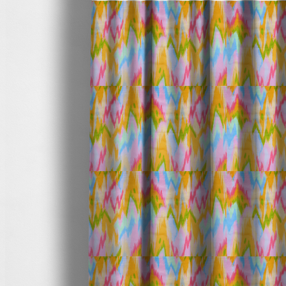 The fabric used to create these made-to-measure curtains is a fabric features a vibrant, multi-coloured ikat-style pattern with a soft, blurred aesthetic.