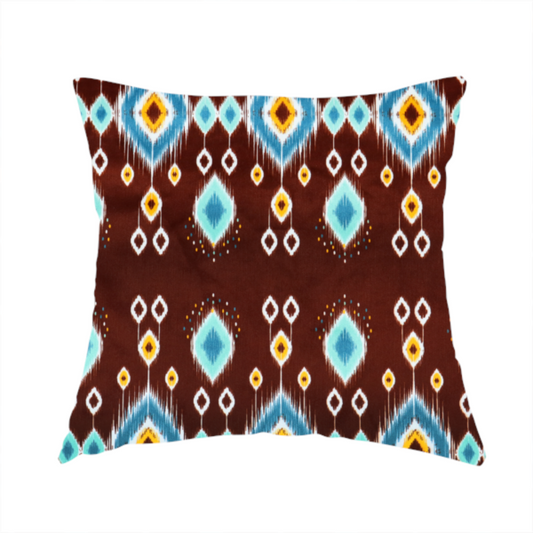 The fabric used to create this handmade cushion is a fabric features a geometric, traditional-inspired ikat pattern set against a deep, rich chocolate-brown background.
