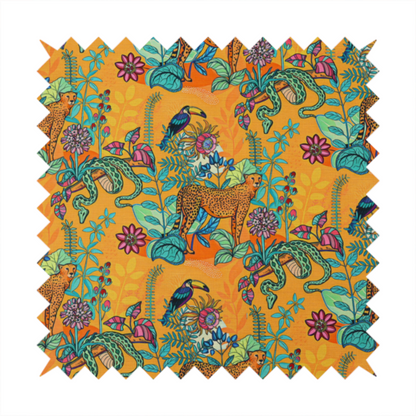 This vibrant, maximalist fabric features a stylized jungle motif set against a bold, warm orange background.
