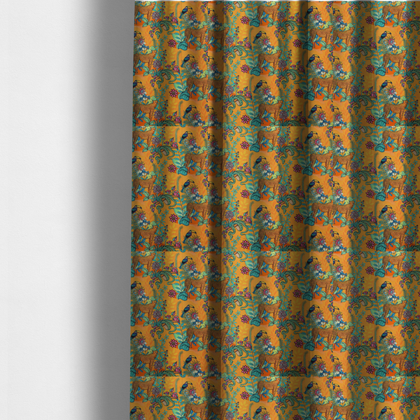 The fabric used to create these made-to-measure curtains is a vibrant, maximalist fabric features a stylized jungle motif set against a bold, warm orange background.