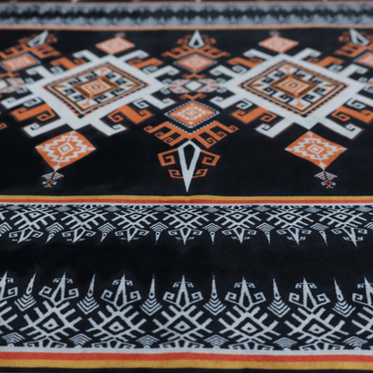 This fabric features a striking, traditional-style geometric pattern reminiscent of Southeast Asian ethnic textiles (such as Thai or Laotian silk motifs).