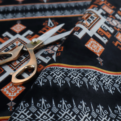 This fabric features a striking, traditional-style geometric pattern reminiscent of Southeast Asian ethnic textiles (such as Thai or Laotian silk motifs).