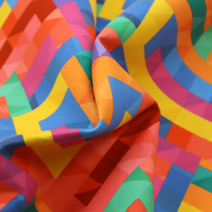 This fabric features a vibrant, geometric, and modular design that creates a dynamic, three-dimensional effect.