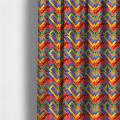 The fabric used to create these made-to-measure curtains is a fabric features a vibrant, geometric, and modular design that creates a dynamic, three-dimensional effect.