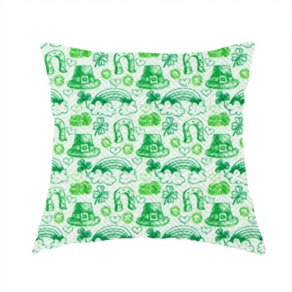 The fabric used to create this handmade cushion is a seamless St. Patrick’s Day fabric pattern featuring hand-sketched green icons including leprechaun top hats, lucky horseshoes, rainbows over clouds, four-leaf clovers, and small gold coins on a white textured background.