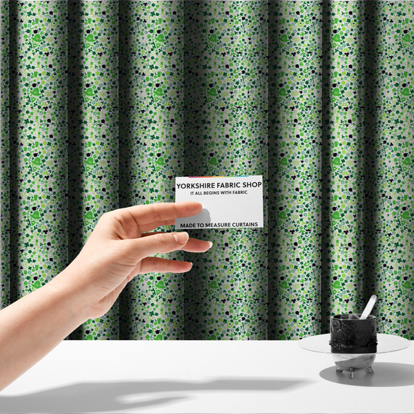 The fabric used to create these made-to-measure curtains is a seamless St. Patrick’s Day fabric pattern on a white background featuring green party bunting banners, frothy beer mugs, leprechaun hats with sunglasses, pipes, horseshoes, and black and green shamrocks.